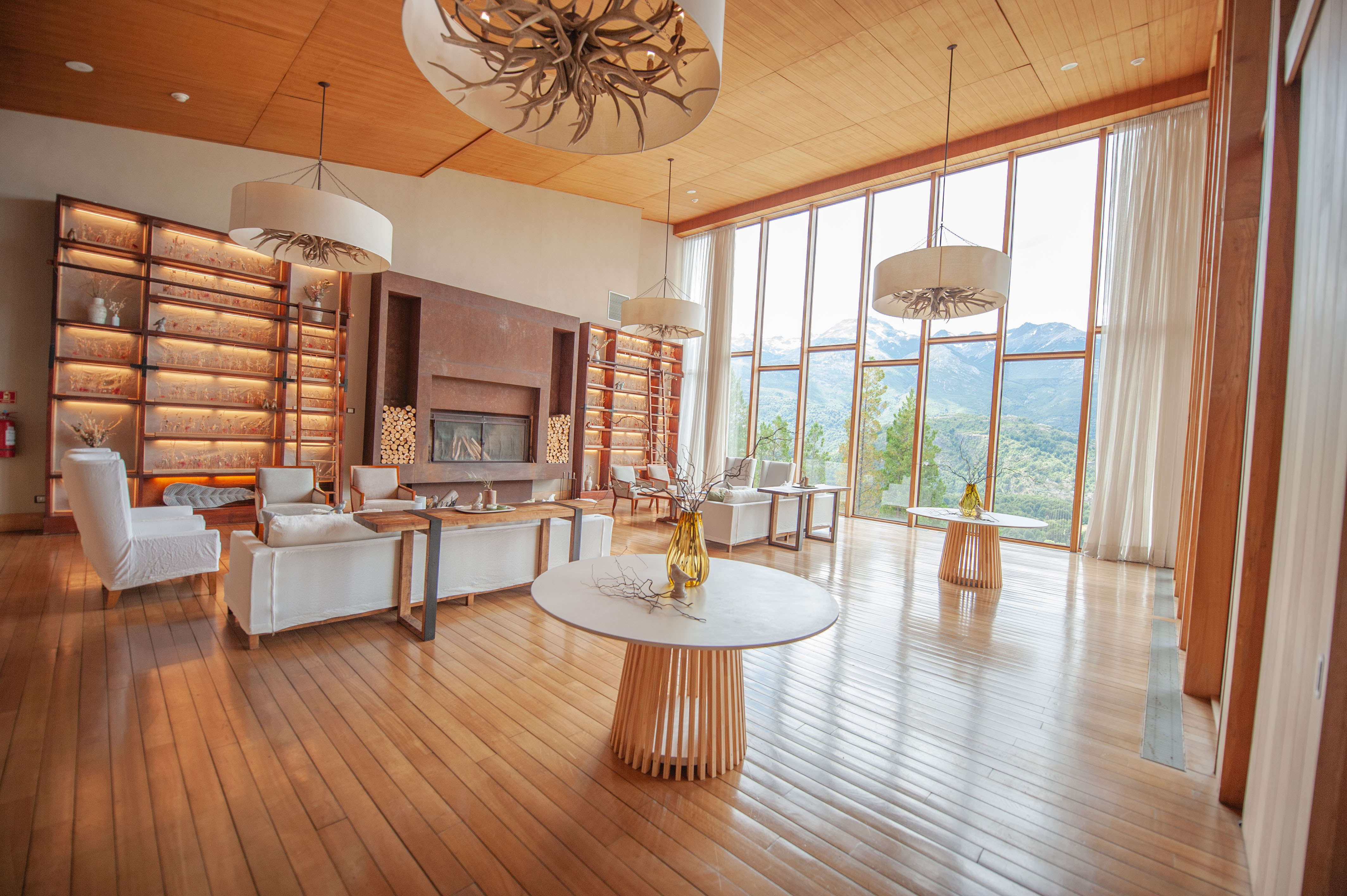The Lodge's main living room with mountain views and floor-to-ceiling windows